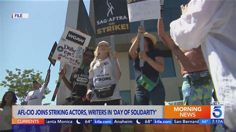 Writers, actors rally with other unions at Disney Studios